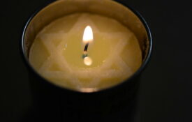 Holocaust Remembrance Day Candle © 2012 by SLGC is licensed under CC BY 2.0